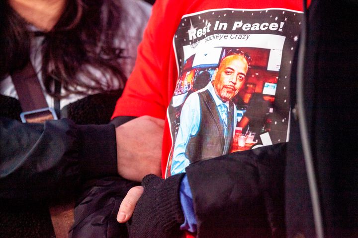 Andre Hill's daughter wears a T-shirt with the image of her father during a press conference and candlelight vigil in Columbus, Ohio, on Dec. 26, 2020. The officer who shot Hill has been charged with murder.