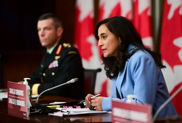 Major-General Dany Fortin, left, and Minister of Public Services and Procurement Anita Anand, take part in an update on the COVID-19 pandemic in Ottawa on Dec. 15, 2020. 