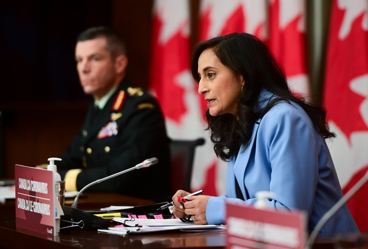 Major-General Dany Fortin, left, and Minister of Public Services and Procurement Anita Anand, take part in an update on the COVID-19 pandemic in Ottawa on Dec. 15, 2020. 