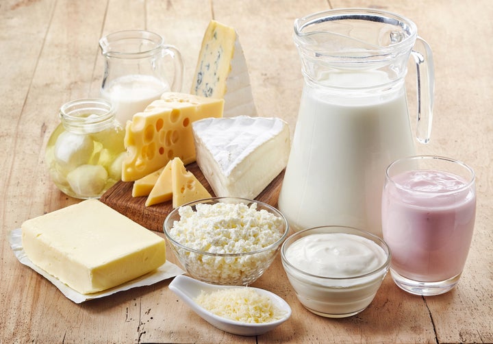 Various fresh dairy products on wooden background