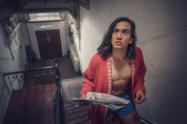 Ash (Nathaniel Curtis) in the Pink Palace's communal hallway