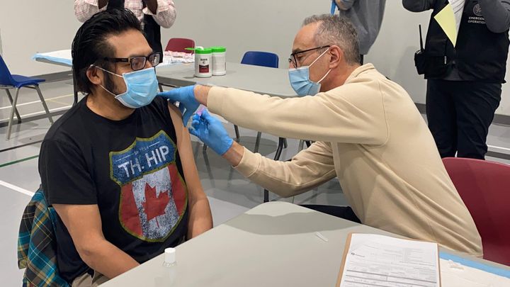 MPP Sol Mamakwa gets vaccinated against COVID-19 at Muskrat Dam First Nation in his riding of Kiiwetinoong on Feb. 1, 2021.