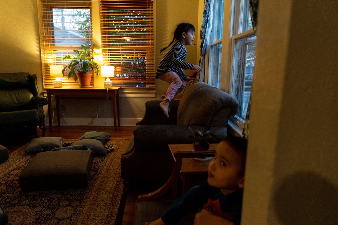 Aida's two elder children play at the shelter while their mother cooks dinner on Feb. 4.