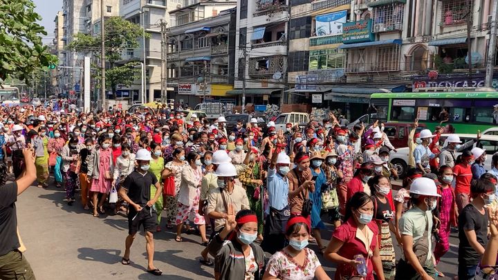 In this image from video, a crowd of protesters march in Yangon, Myanmar Saturday, Feb. 6, 2021. 