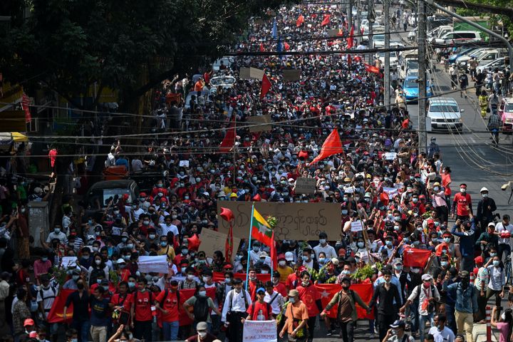 Protesters march during a demonstration against the military coup in Yangon on February 7, 2021. (Photo by Ye Aung THU / AFP) (Photo by YE AUNG THU/AFP via Getty Images)