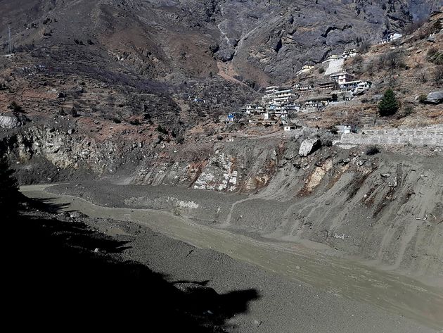 <strong>Mud and slash are seen in the Dhauliganga River after a portion of Nanda Devi glacier broke off in Tapovan area of the northern state of Uttarakhand.</strong>” data-caption=”<strong>Mud and slash are seen in the Dhauliganga River after a portion of Nanda Devi glacier broke off in Tapovan area of the northern state of Uttarakhand.</strong>” data-rich-caption=”<strong>Mud and slash are seen in the Dhauliganga River after a portion of Nanda Devi glacier broke off in Tapovan area of the northern state of Uttarakhand.</strong>” data-credit=”ASSOCIATED PRESS” data-credit-link-back=”” /></p>
<div class=