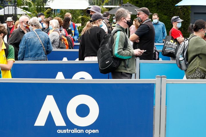 Spectators wear face masks as they arrive on day one of the 2021 Australian Open at Melbourne Park on February 08, 2021 in Melbourne, Australia.