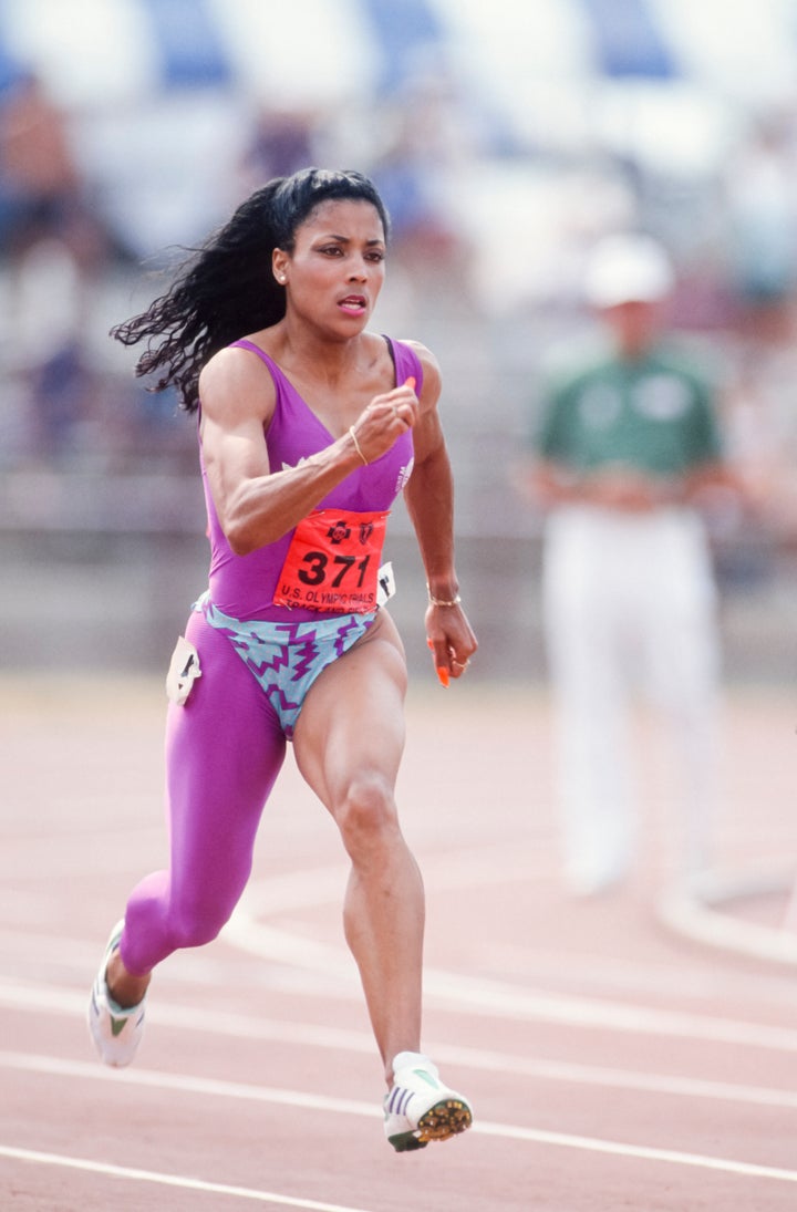 Florence Griffith Joyner running in one of her bold one-legged uniforms at the 1988 U.S. Olympic track and field trials.