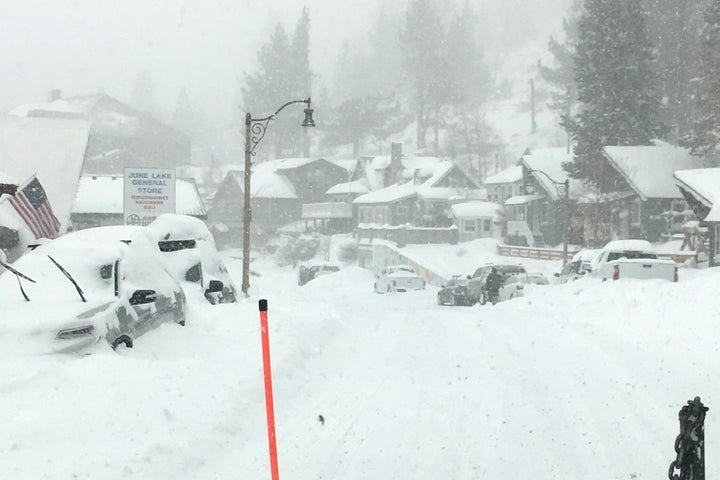 Heavy snowfall blankets cars at June Lake in Mono County, California, on Jan. 27.