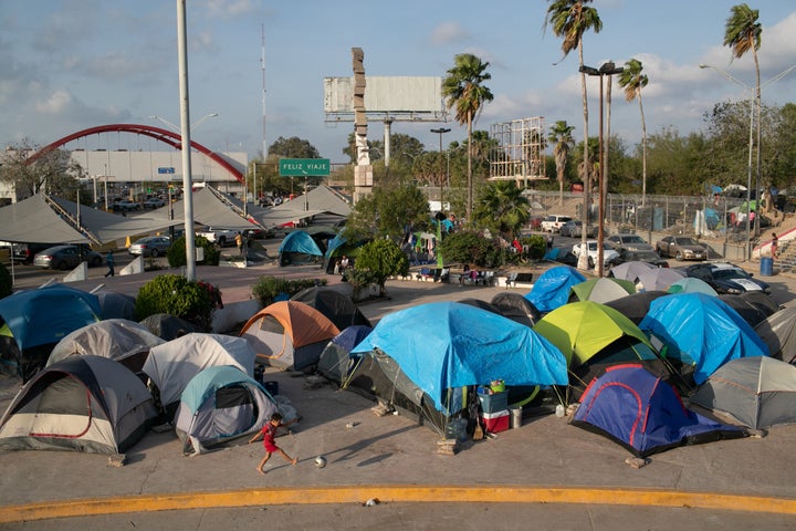 A camp for asylum-seekers stands next to the international bridge to the United States in Matamoros, Mexico.