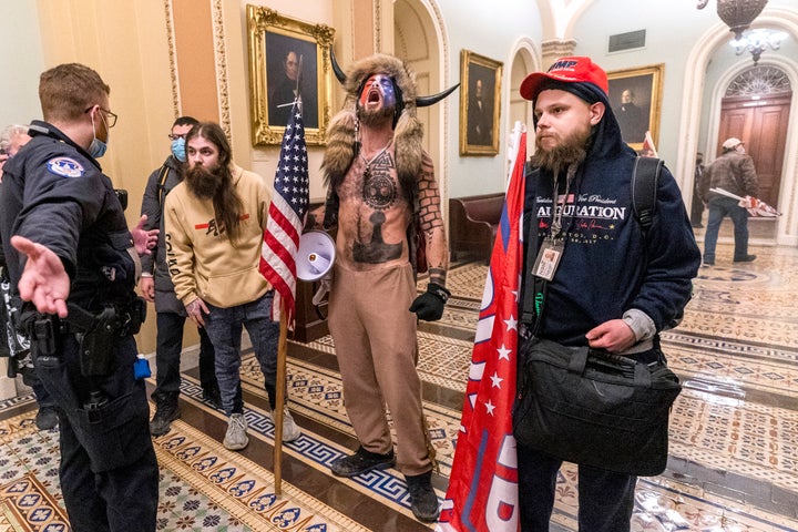 Supporters of then-President Donald Trump, including Jacob Chansley, center, are confronted by Capitol Police in Washington on Jan. 6, 2021.