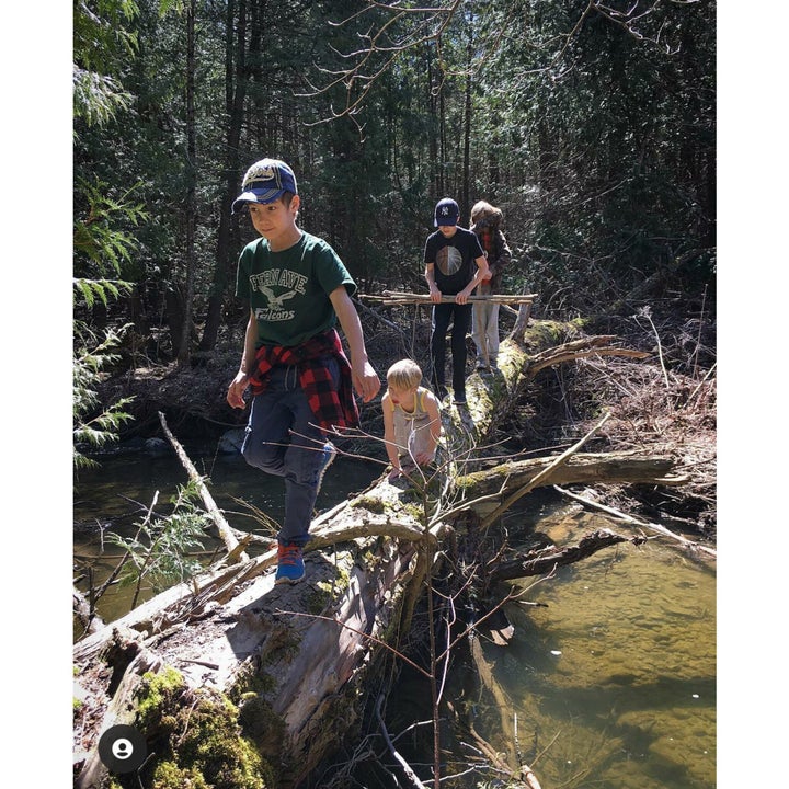 Sibling love doesn't always look like hugs, sometimes it's expressed through shared purpose and subtle looks of connectednes during play activities.