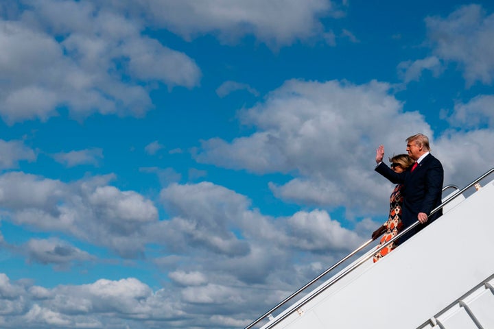 Donald Trump and Melania Trump step off Air Force One as they arrive at Palm Beach International Airport in West Palm Beach, Florida, on January 20.