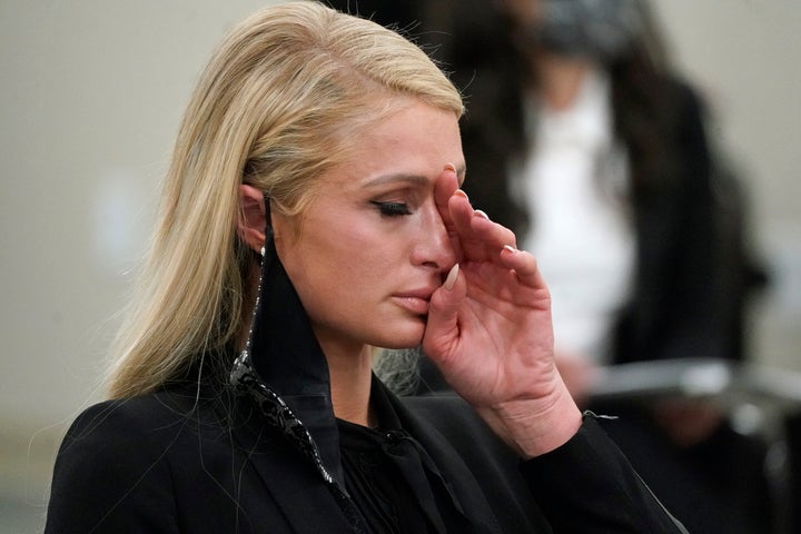 Paris Hilton wipes her eyes after speaking at a committee hearing at the Utah State Capitol, Monday, Feb. 8, 2021, in Salt Lake City.