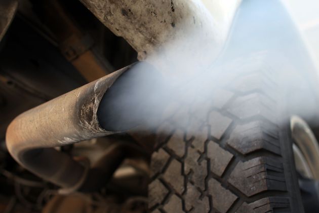 Exhaust flows out of the tailpipe of a vehicle in