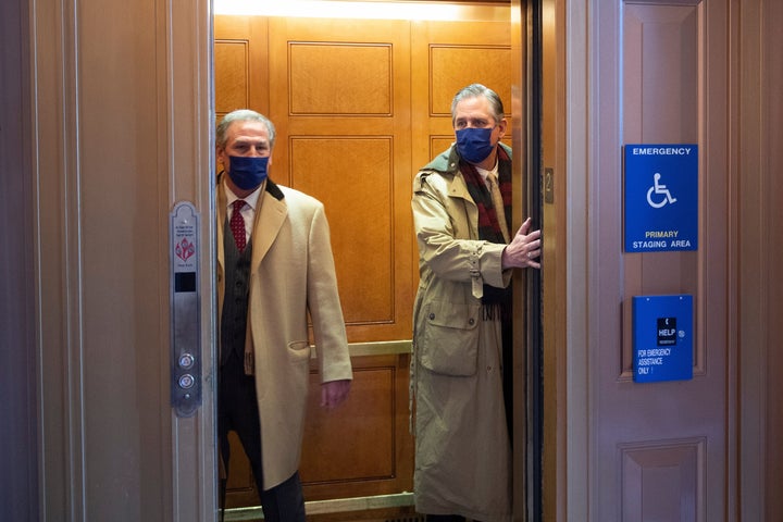 Bruce Castor Jr. (right), a member of former President Donald Trump's legal team, on Capitol Hill this week. He is one of the authors of a brief claiming rioters who attacked the U.S. Capitol last month did so “of their own accord” and not because Trump encouraged them. 