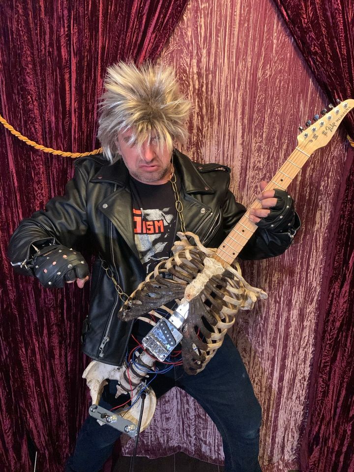 Florida-based musician Prince Midnight shows off his guitar made from his Uncle Filip's bones.