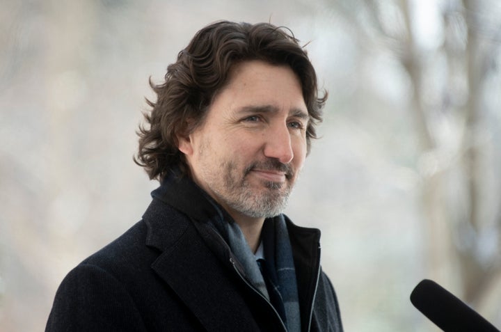 Prime Minister Justin Trudeau listens to a reporters question outside Rideau Cottage Ottawa on Feb. 9, 2021.