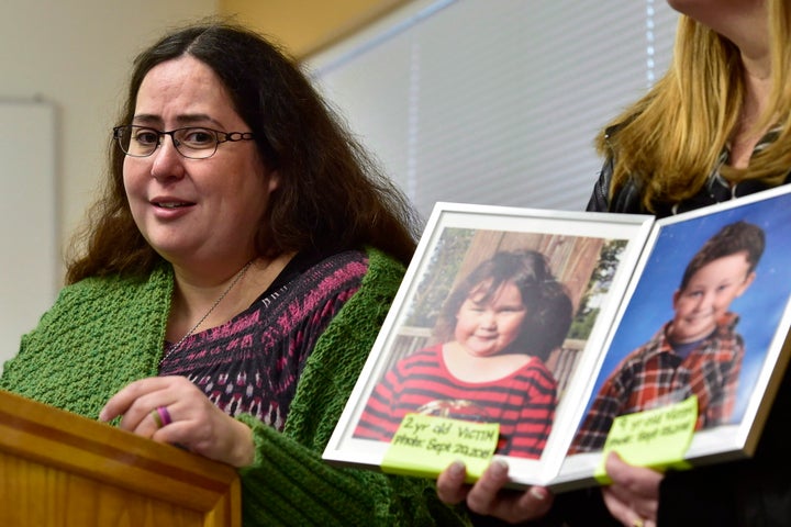 Jennifer Neville-Lake speaks as a supporter holds a photo of her late daughter Milly, left, and son Daniel, during a press conference following Marco Muzzo's parole hearing on Nov. 7, 2018.
A panel with the Parole Board of Canada says Muzzo has not addressed his alcohol misuse, and denied him both day parole and full parole.