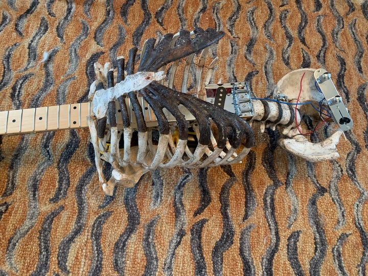 Tampa musician Prince Midnight attached his dead uncle's skeleton to a discarded Fender Telecaster.