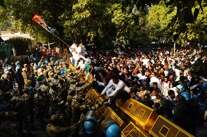 Protesters broke down barricades and clashed with police in New Delhi on Feb. 09, 2021.