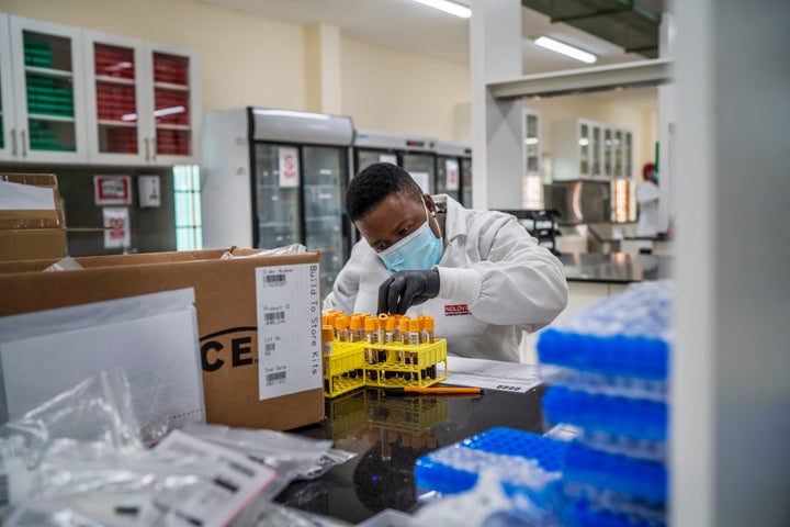 A lab technician works on blood samples taken from people taking part in a Johnson & Johnson Covid-19 vaccine test at the Ndlovu clinic's lab in Groblersdal, South Africa on Feb. 11, 2021. 