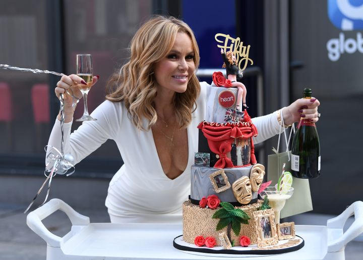 Amanda Holden posing with a special cake in honour of her birthday