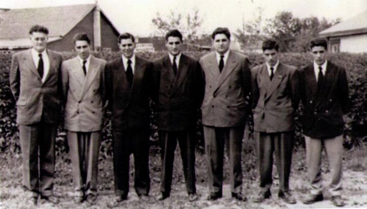 The writer's grandfather, far left, stands with his sons in a photo dated 1951. The writer's father, furthest right, never knew his heritage.