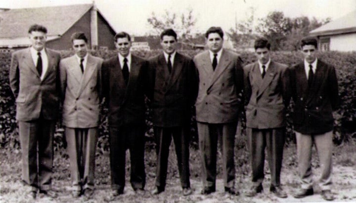 The writer's grandfather, far left, stands with his sons in a photo dated 1951. The writer's father, furthest right, never knew his heritage.