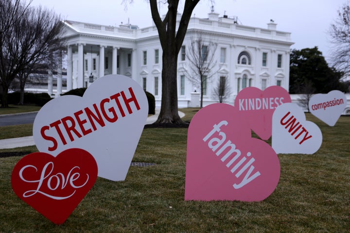 Heart-shaped signs with Valentine messages on the North Lawn of the White House on Feb. 12, 2021, in Washington, D.C.