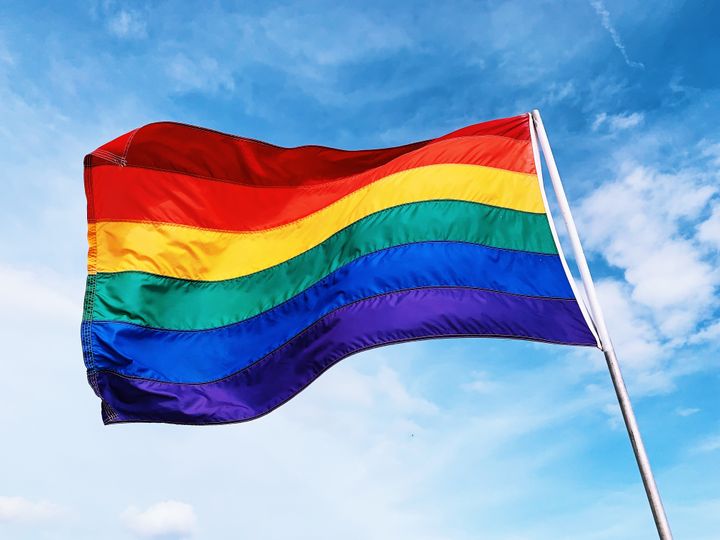 A rainbow flag celebrating LGBTQ+ pride. 