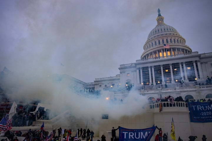 Tear gas wafts across the grounds of the U.S. Capitol during the siege of the building by supporters of then-President Donald Trump on Jan. 6. The rioters had headed to the Capitol after Trump exhorted them to so at a nearby rally.