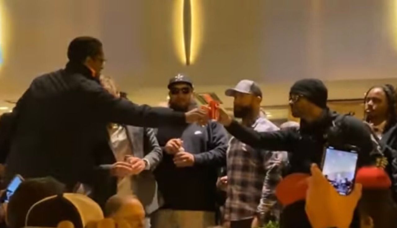 Ali Alexander and Proud Boys leader Enrique Tarrio toast in November 2020, after a Stop the Steal rally in Washington.
