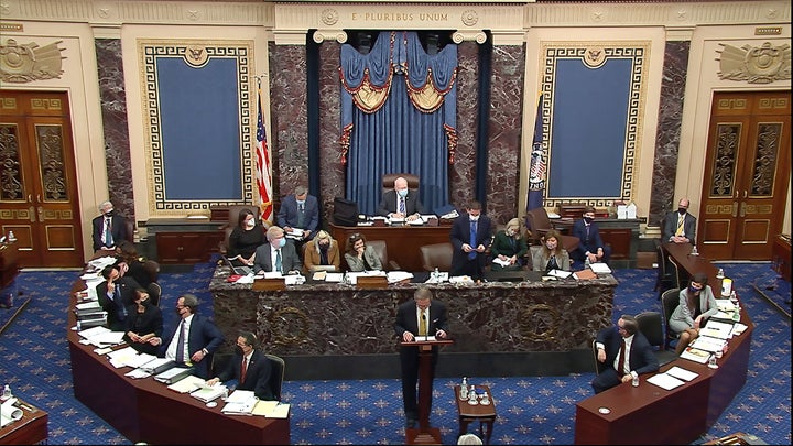 In this image from video, Michael van der Veen, an attorney for former President Donald Trump, listens as the clerk read a qu