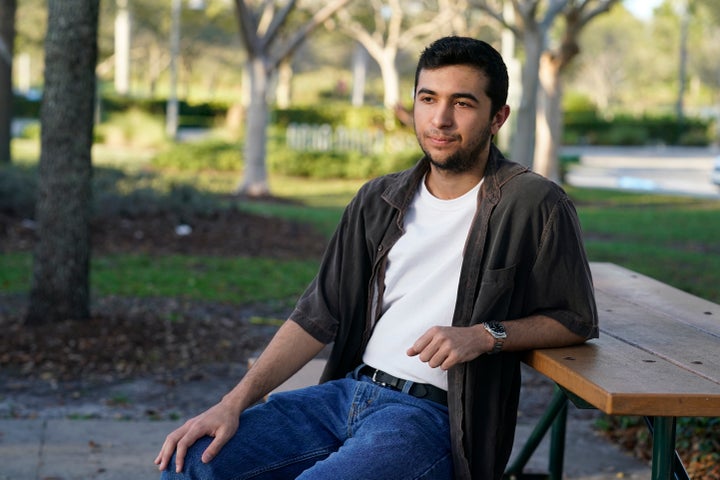 Ryan Servaites sits at a park, Thursday, Feb. 11, 2021 in Parkland, Fla. Servaites was freshman at Marjory Stoneman Douglas when the shooting occurred(AP Photo/Marta Lavandier)