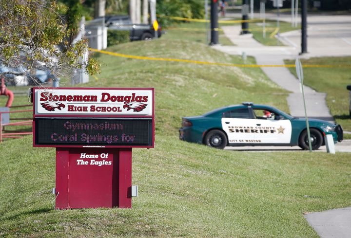Law enforcement officers block off the entrance to Marjory Stoneman Douglas High School in Parkland, Florida, on Feb. 15, 2018, after a mass shooting left 17 people dead.