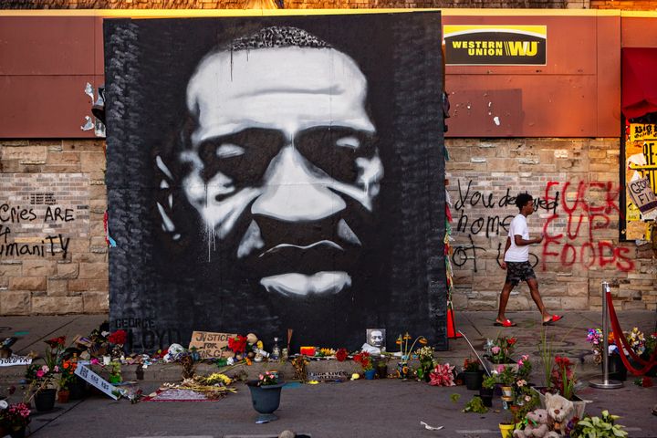 MINNEAPOLIS, MN - JULY 26: A large black and white mural of George Floyds face stands tall on the sidewalk outside of Cup Foods near where Floyd was killed on Sunday, July 26, 2020 in Minneapolis, MN. (Jason Armond / Los Angeles Times via Getty Images)