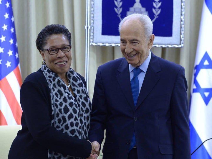 Rep. Marcia Fudge meets with then-Israeli President Shimon Peres in Feb. 2014. U.S.-Israel policy has become an issue in the race to succeed Fudge.