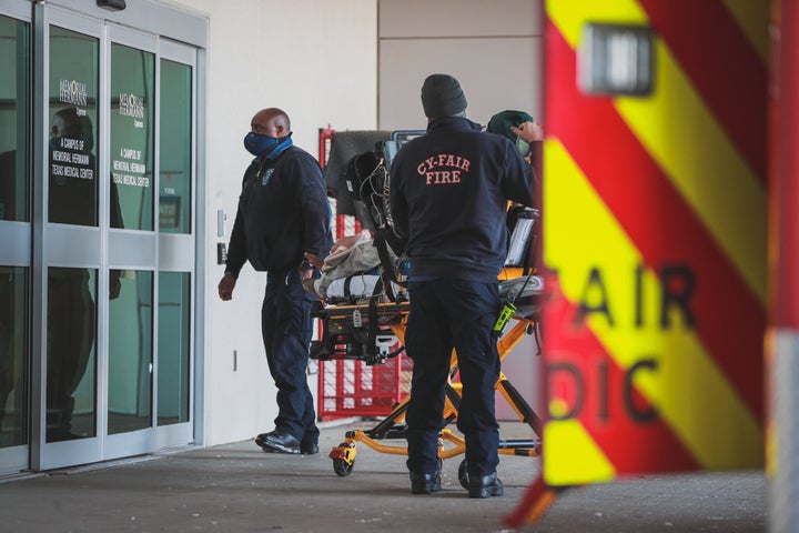 A person is seen arriving at a Houston-area for treatment on Monday following a carbon monoxide poisoning that's believed to have involved a charcoal grill being used inside for warmth. 