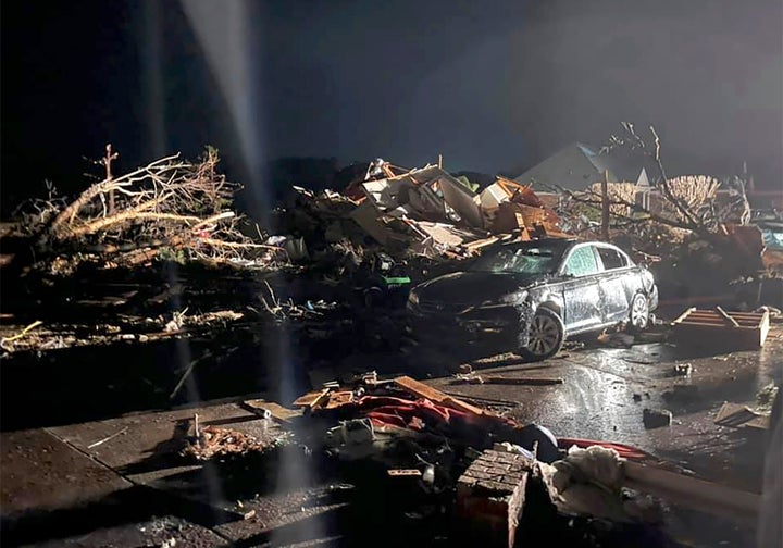 A damaged vehicle is seen among debris after a deadly tornado tore through Brunswick County, N.C., Tuesday, Feb. 16, 2021. (Emily Flax/Brunswick County Sheriff’s Office via AP)