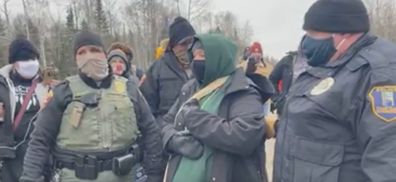 Dawn Goodwin, pictured in the green hoodie in the center, was cited on Dec. 12, 2020, for stepping too close to the Line 3 pipeline construction site during a protest.