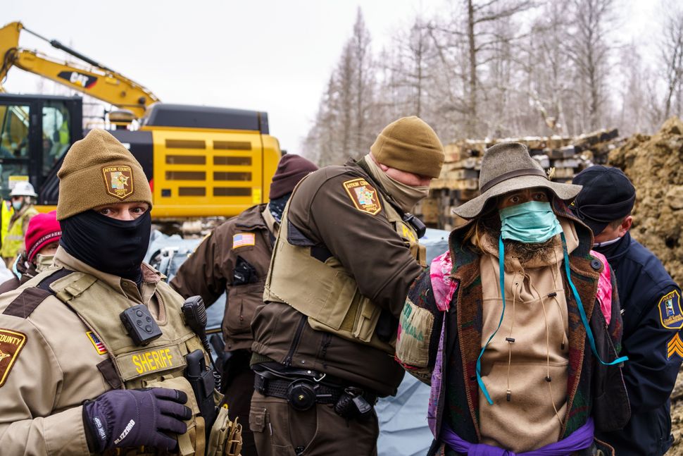 Sheriffs in Aitkin County, Minnesota, arrest "water protectors" during a protest at the construction site of the Line 3 oil p