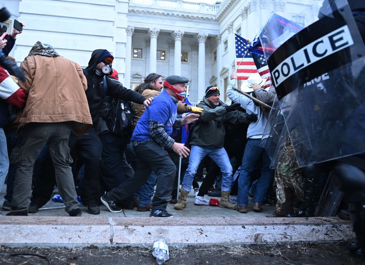 Trump supporters clash with police and security forces as they storm the U.S. Capitol on Jan. 6.