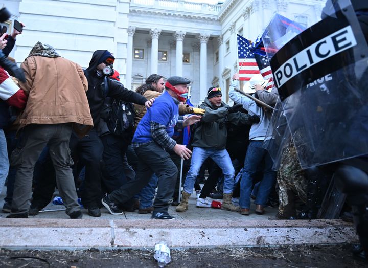 Trump supporters clash with police and security forces as they storm the U.S. Capitol on Jan. 6.