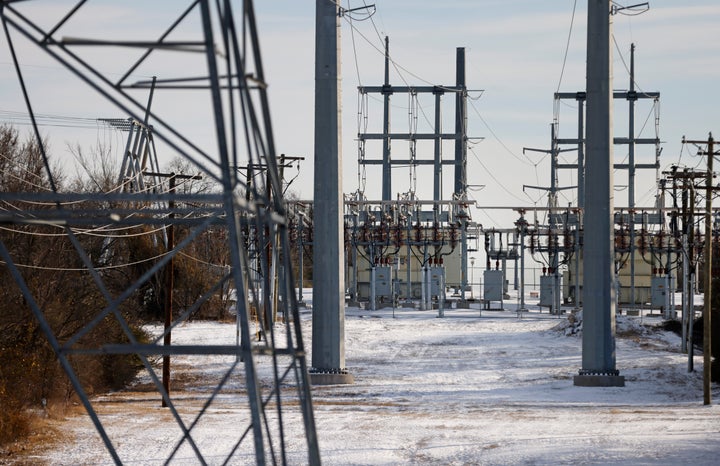 Transmission towers and power lines lead to a substation after a snowstorm on Feb. 16, 2021, in Fort Worth, Texas.