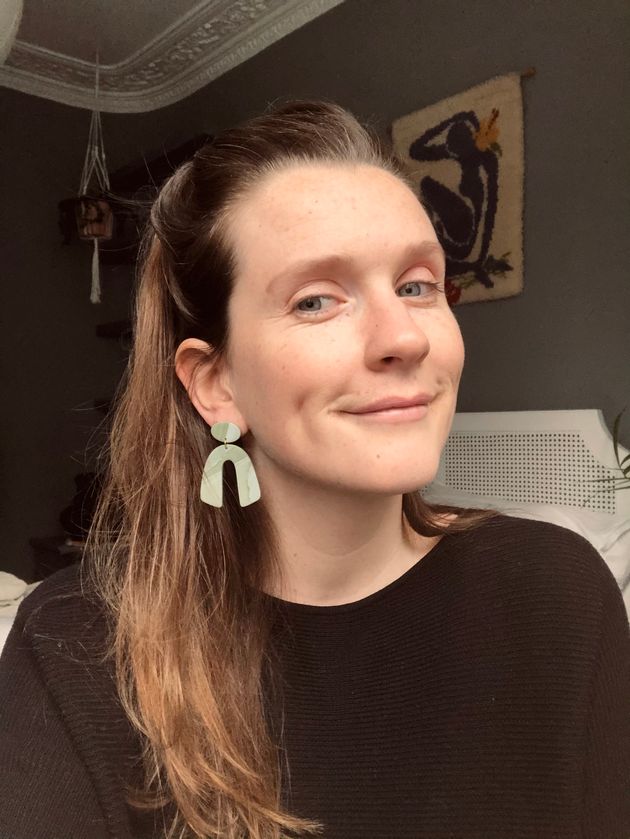 Claire Owens wearing handmade clay earrings. She set up a jewellery venture, while also working full time, in 2020.