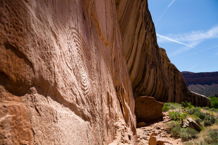 Ruins and a petroglyph are pictured in 2015 along the sheer face of Arch Canyon, located in Bears Ears National Monument.