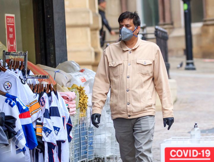 A member of the public wears a face mask in, Bradford in Yorkshire