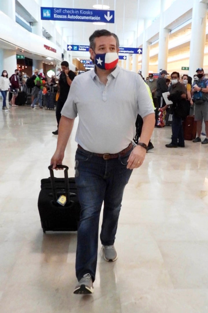 Sen. Ted Cruz (R-Texas) checks in for a flight at Cancun International Airport after a backlash over his family vacation to M