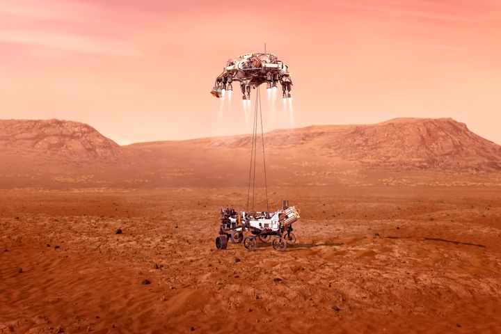 This illustration provided by NASA shows the Perseverance rover, bottom, landing on Mars. (NASA/JPL-Caltech via AP)